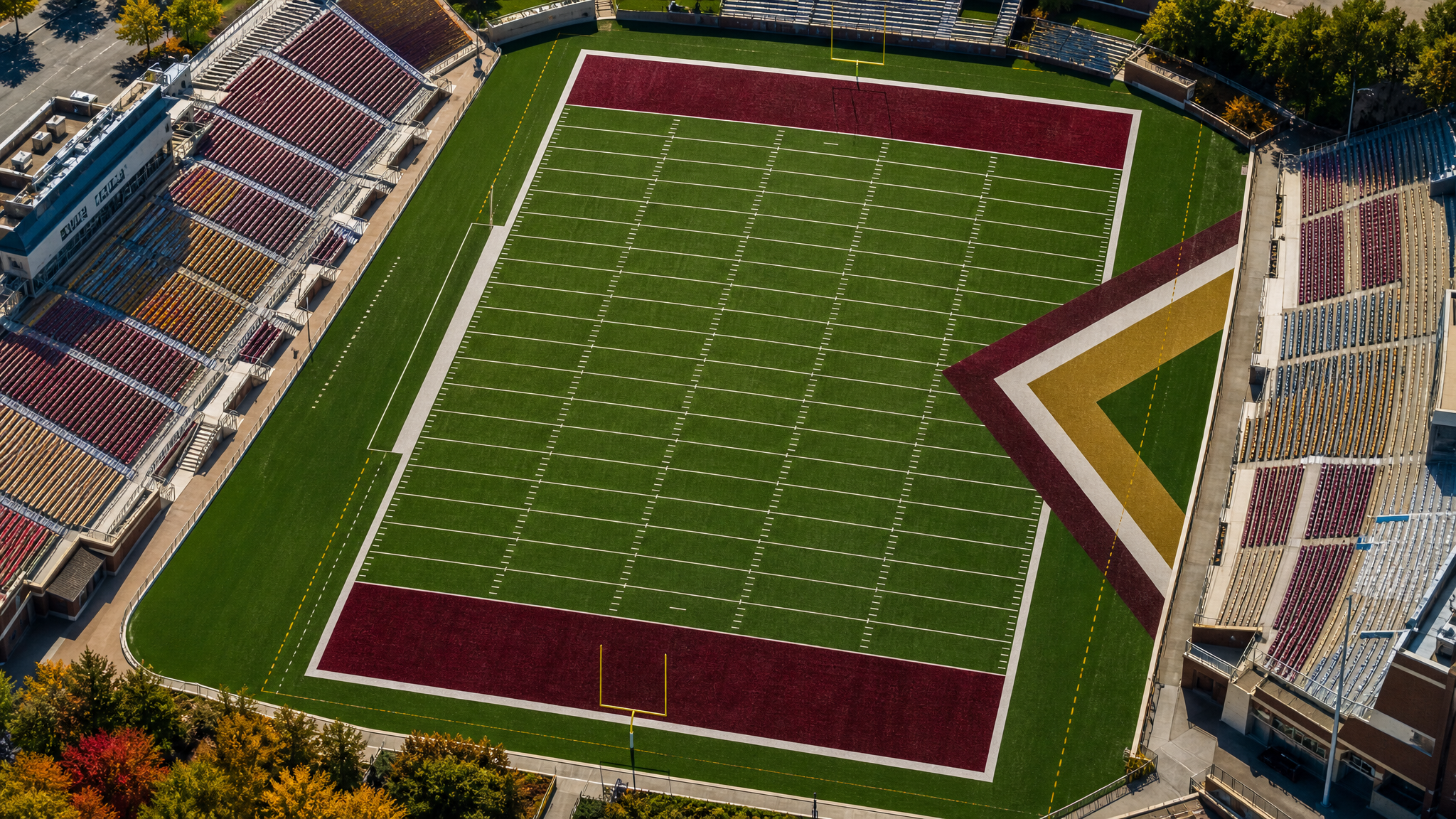 Wide view of a football field from above showing how a sponsor mark competes with yard lines, numbers, and end zones