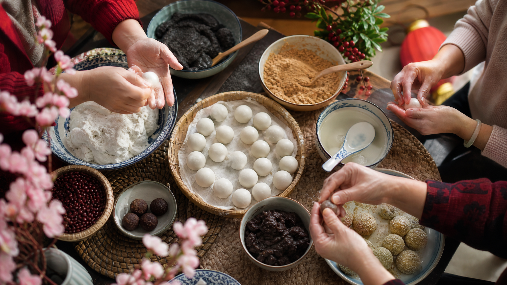 Hands shaping festive sweets at a family table with ingredients neatly arranged