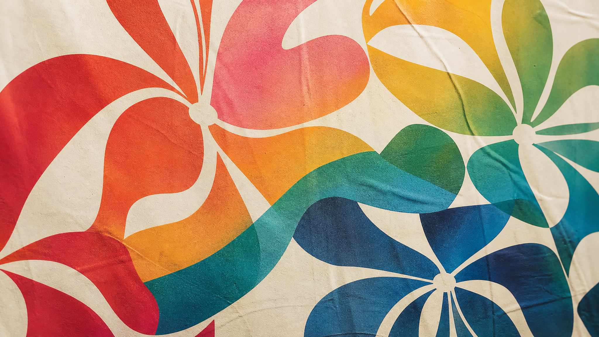 Close view of abstract floral forms built from typographic shapes with color moving across them in wave-like bands