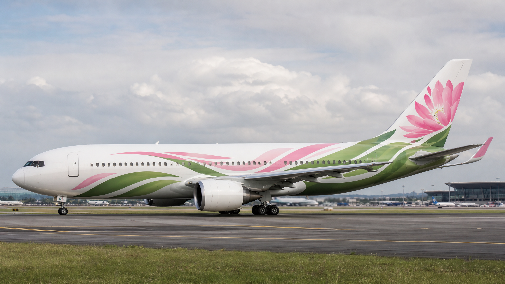 Side view of a passenger aircraft with a flowing petal-inspired graphic moving from nose to tail